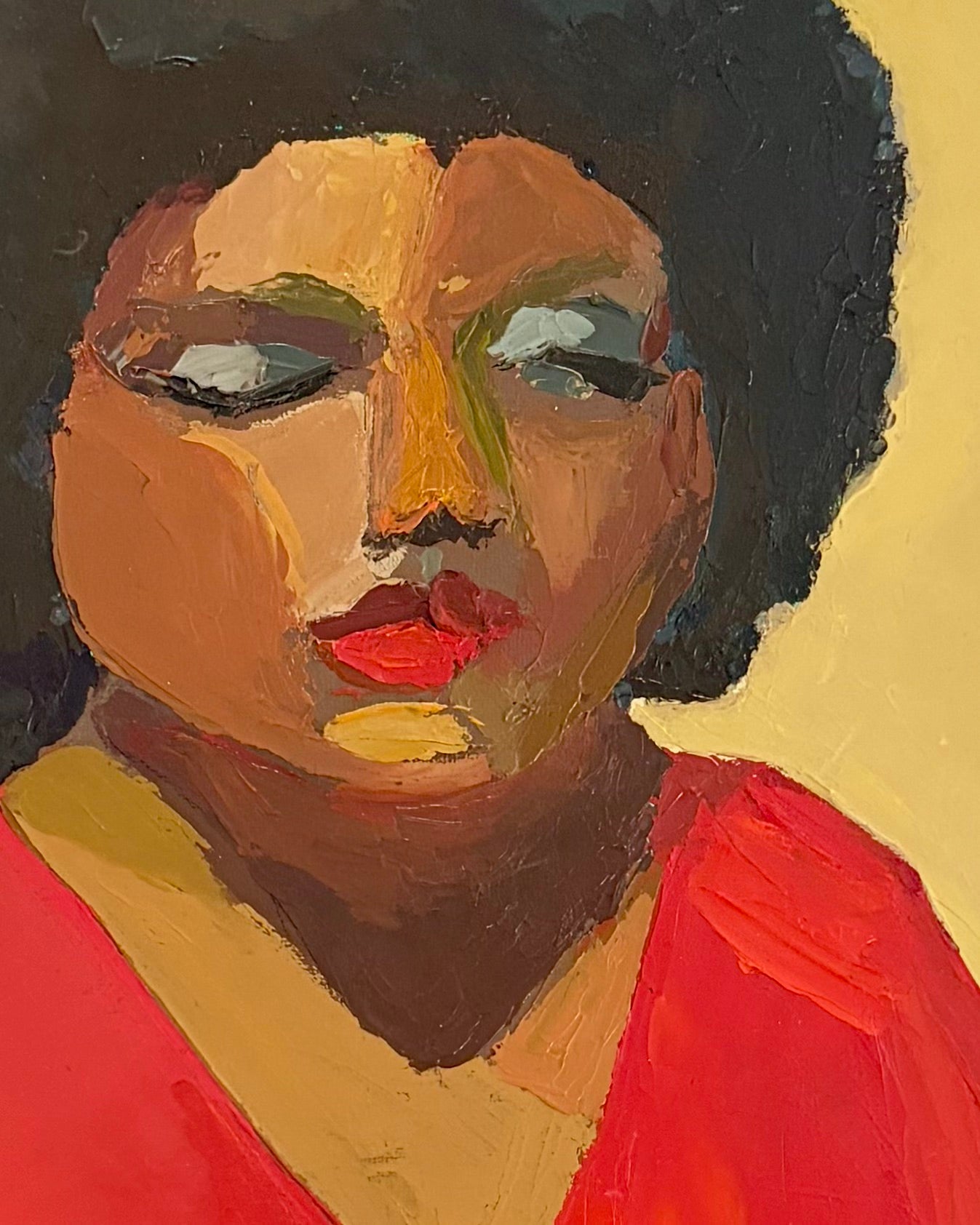 Zoomed in section of an oil painting of a seated woman wearing a red top and green dress against a beige background