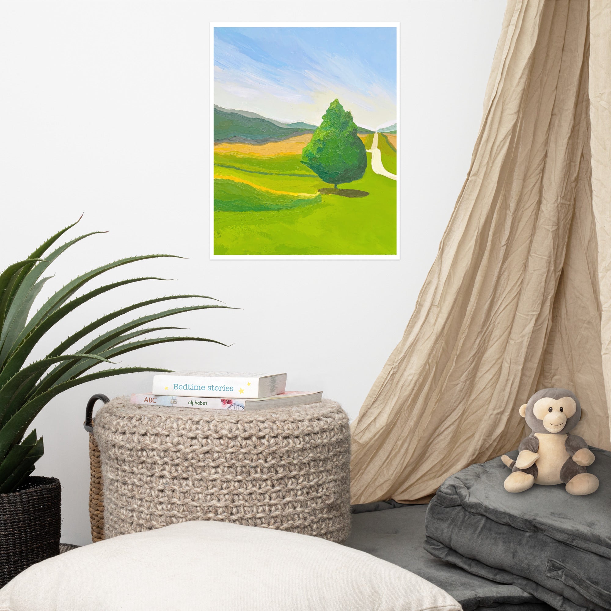 Mock-up of a print of a landscape hanging on a wall in a baby's room