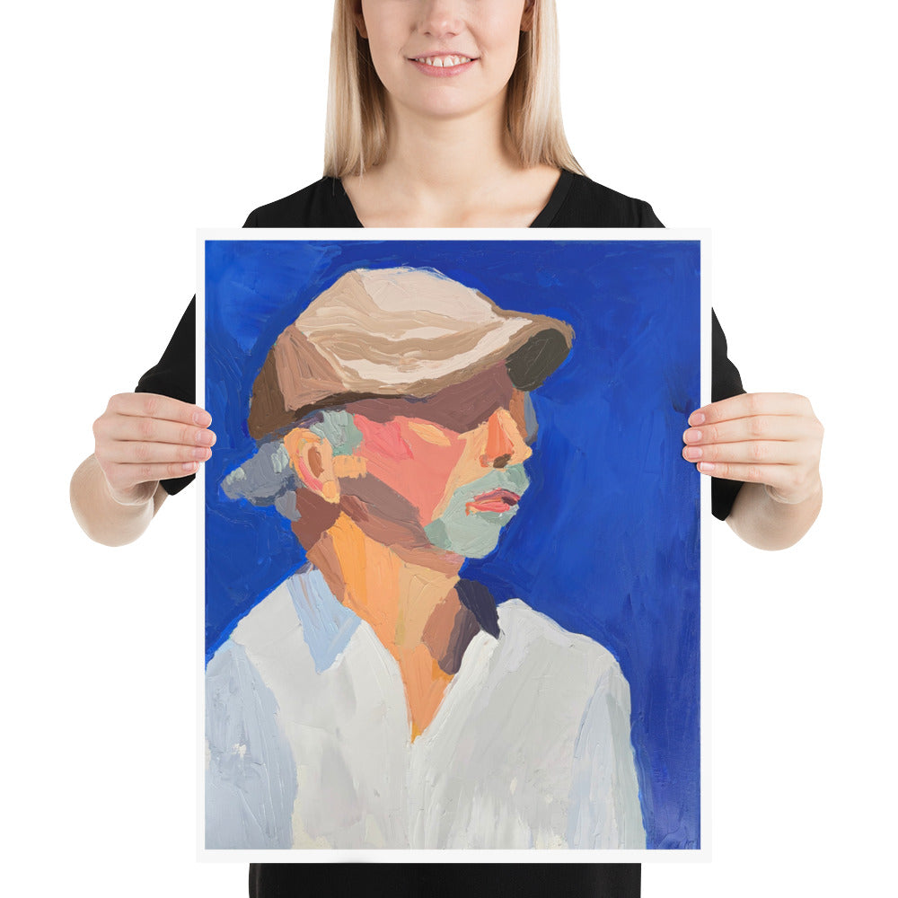 Person holding a painting of a man wearing a hat and white shirt against a bright blue background