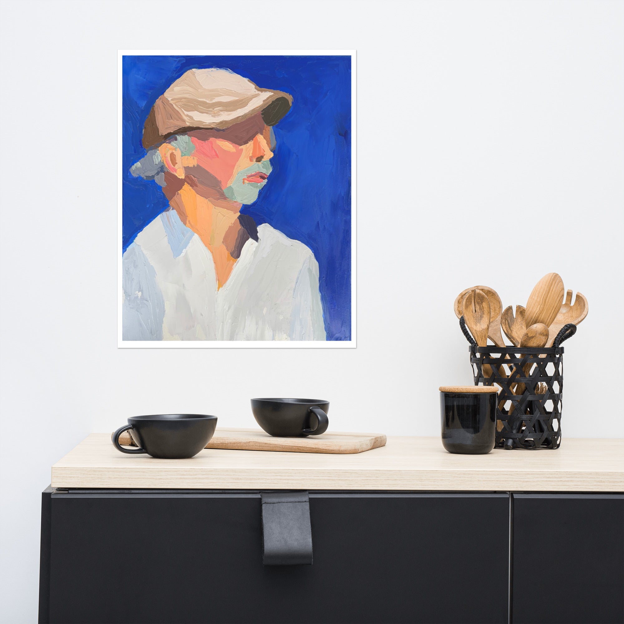 Mock up of a painting of a man in a white shirt hanging on a kitchen wall